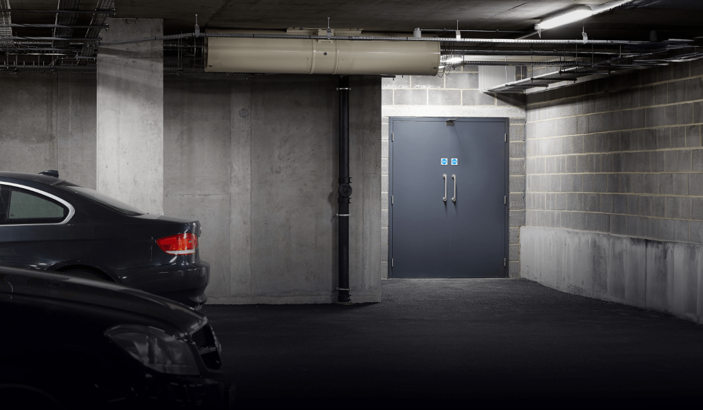 Grey steel fire doors in an underground car park