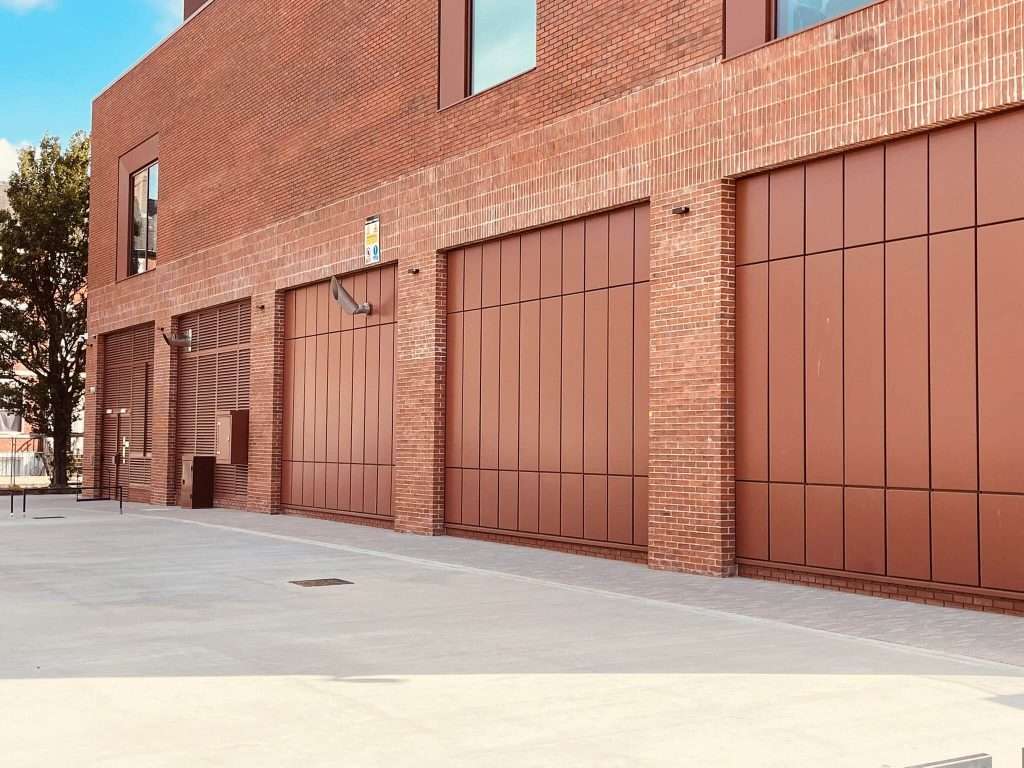Brick building with steel roller shutter door and entrance ramp