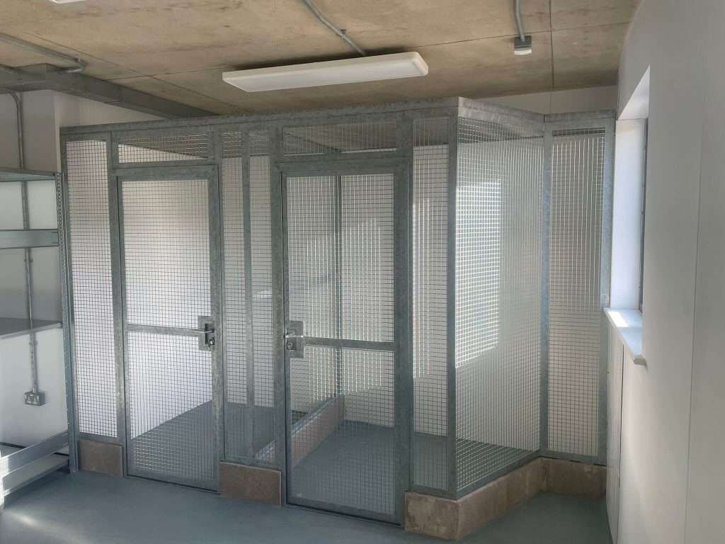 Interior view of a steel-framed animal enclosure