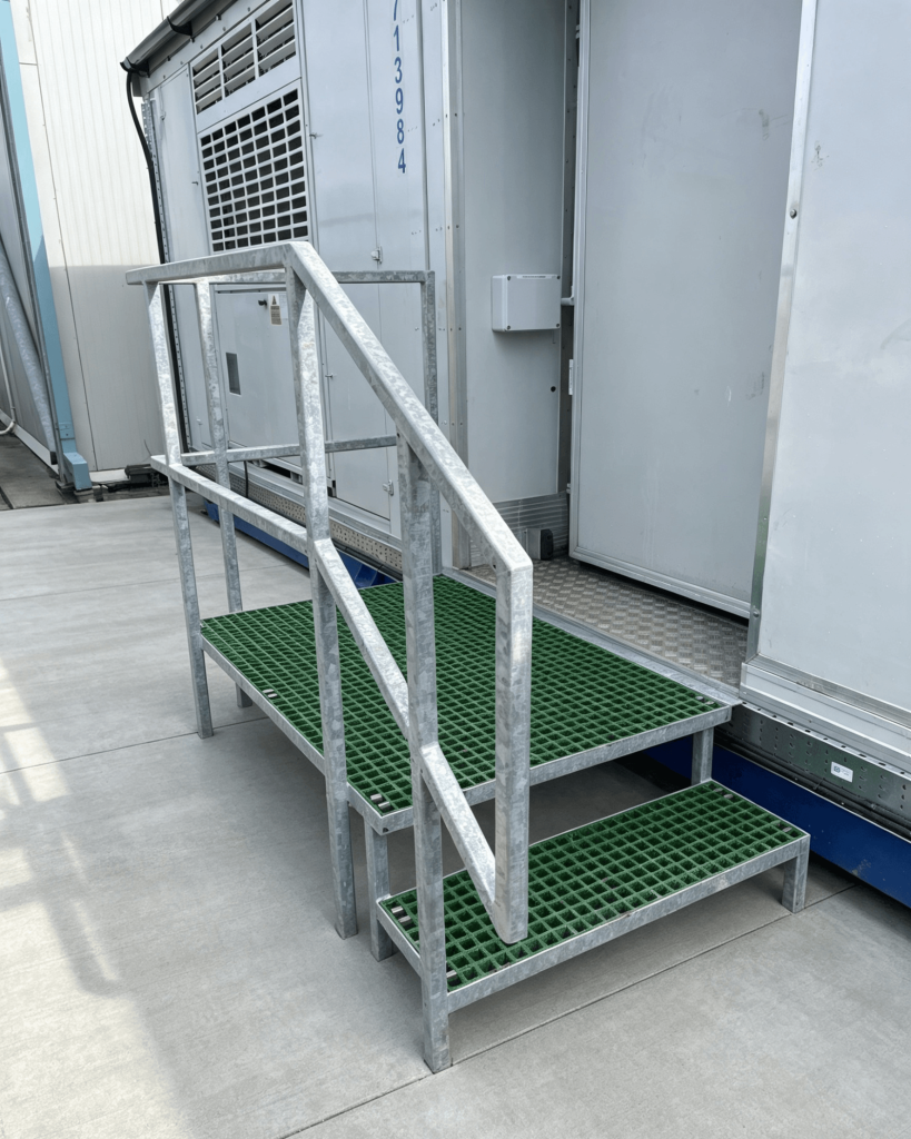 Galvanised steel handrail with GRP grating step and platform
