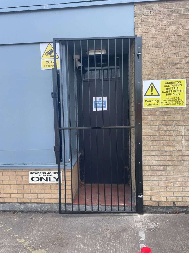 Steel security grille fitted to a building window