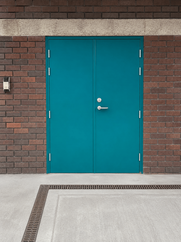 Dark steel double personnel doors with keypad access control
