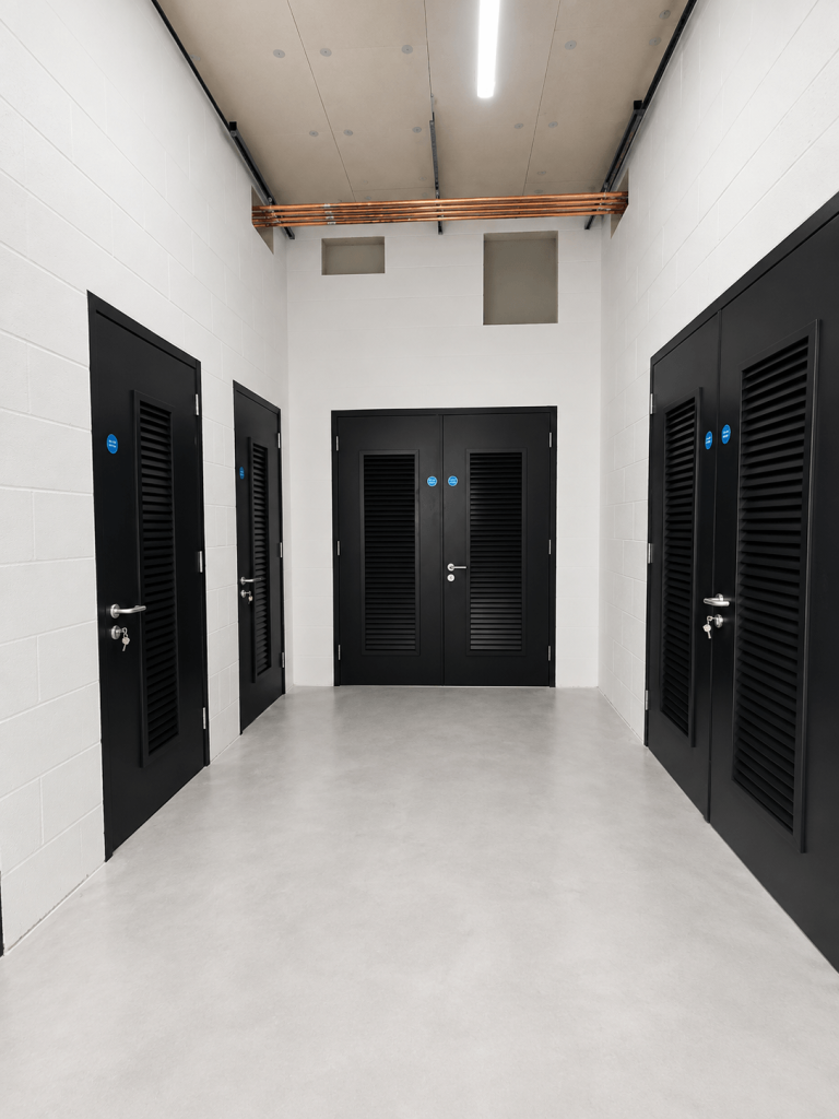 Steel personnel door in a brick exterior wall